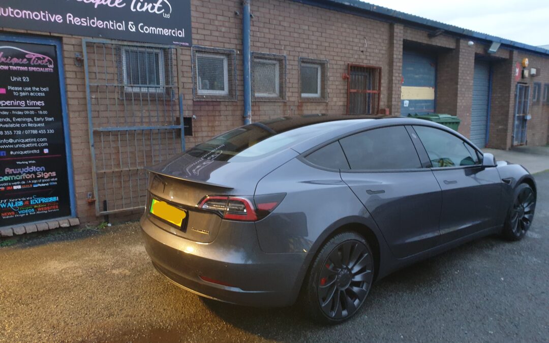 Tesla model 3 tinted, dechrome and wood trim wrapped